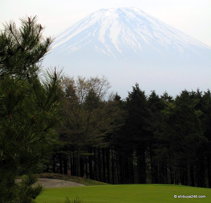 Mt Fuji rises above the golf course