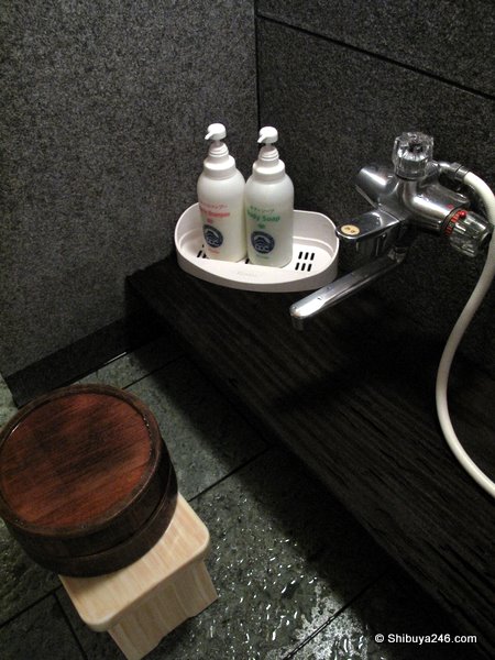 Body soap and shampoo on hand. Shower and faucet available for wash down