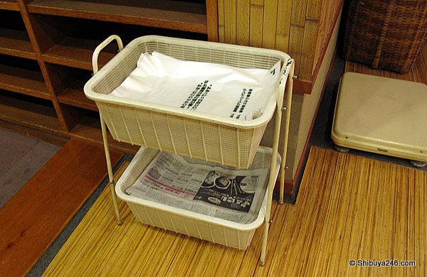Plastic bags for used underwear and newspaper for your shoes provided as service