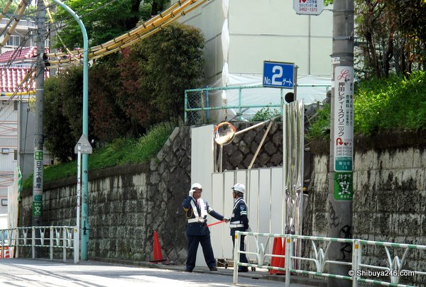 Some guards on duty outside one of the gates