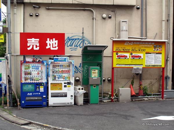 The sign says "Land for sale". Actually a building design and permit are shown for this lot