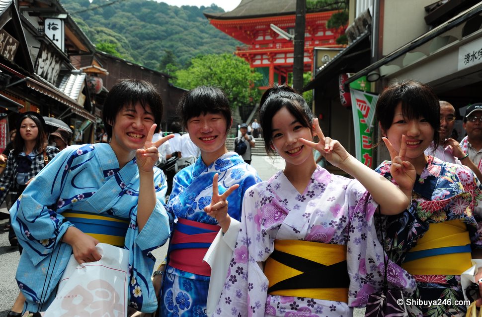 Peace out Japan. Four ladies out for the day in their Yukata having just toured around the Temple grounds