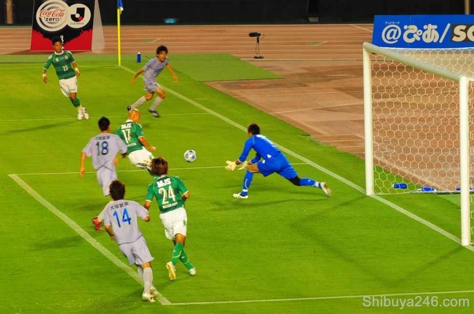An incoming cross is dealt with by the goalkeeper