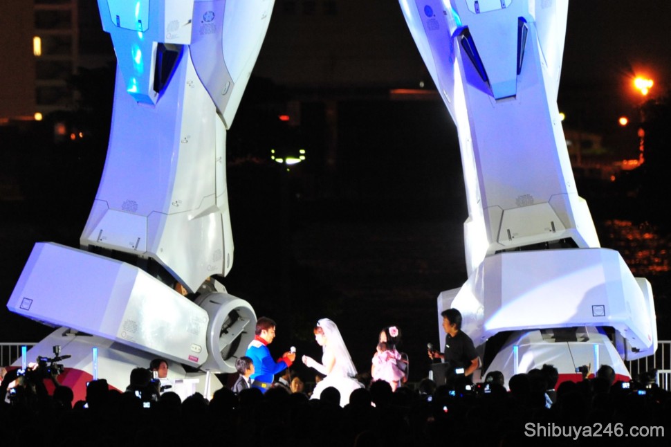 A simple exchange of rings marks the ceremony for the couple