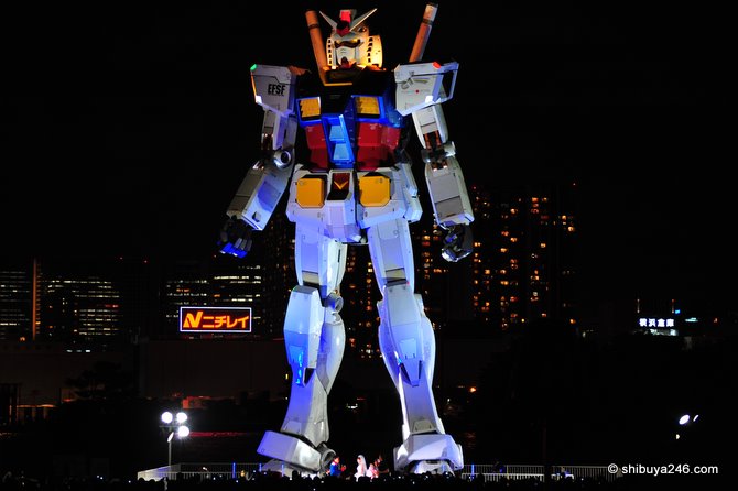 Gundam watches over the wedding ceremony below
