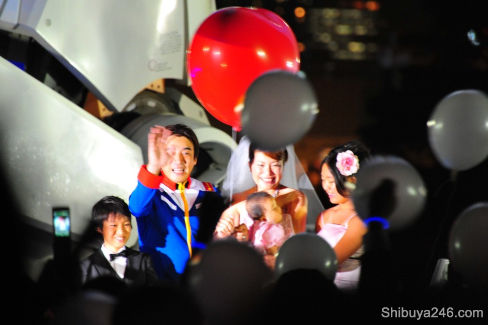 Balloons are prepared for the crowd to launch high into the night sky
