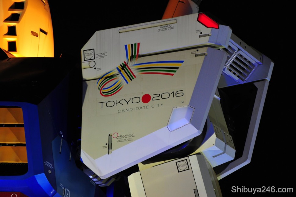 A quick flick of the shoulder and a nod to the Olympic Committee by Gundam. Tokyo is bidding to host the 2016 Olympic, Paralympic Games