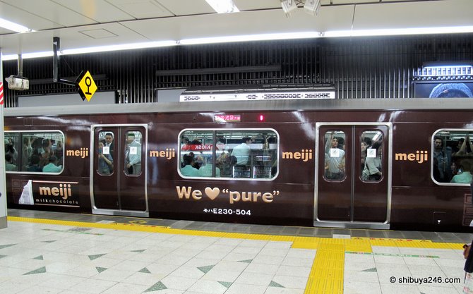 The special wrapped Yamanote Line pulls in to the station