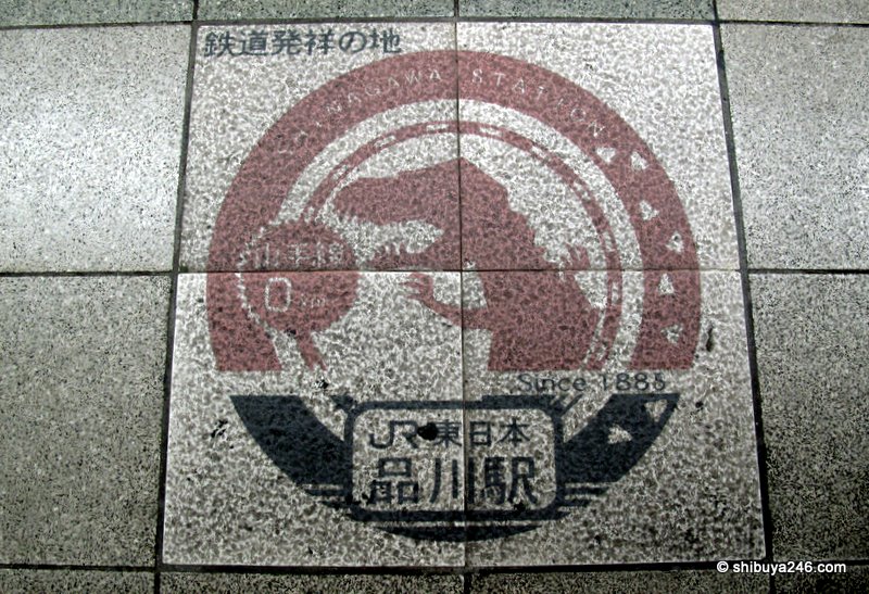 The Godzilla mark on the platform indicating Shinagawa Stations history since 1885