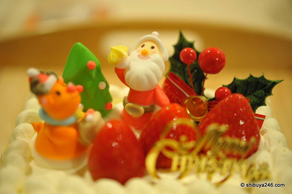 My 2009 Christmas Eve cake. Not cheap at approx $40. I think the price of strawberries goes up at this time of the year.
