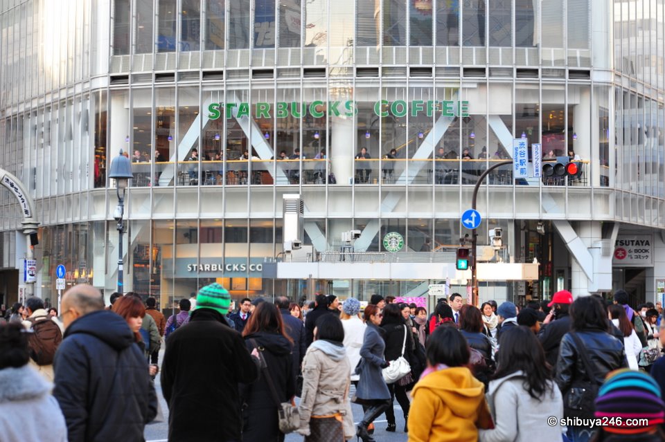 As always, loads of people scrambling across the Shibuya Crossing. Many heading for the warm comfort of Starbucks.