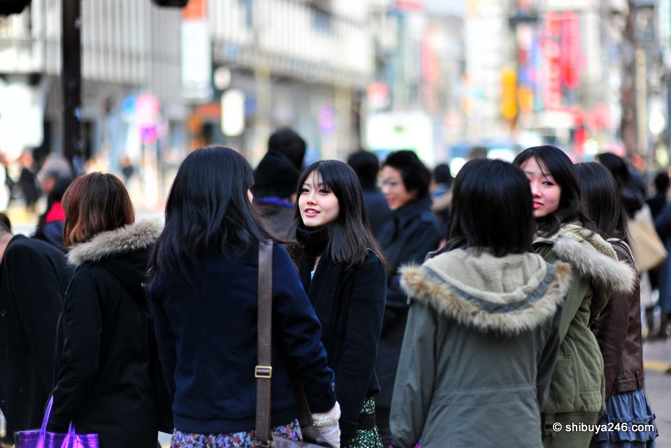 Nice group of faces in the crowd waiting to cross at the Scramble Crossing.