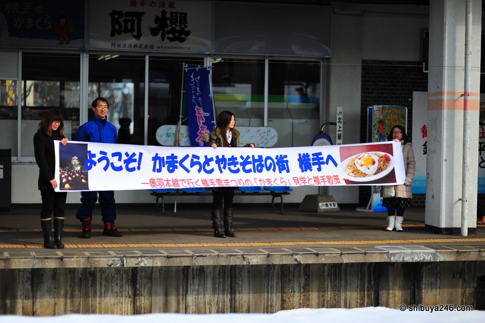The welcoming committee at the local Yokote train station. The sign says "Welcome to Yokote, the town with kamakura and yakisoba"