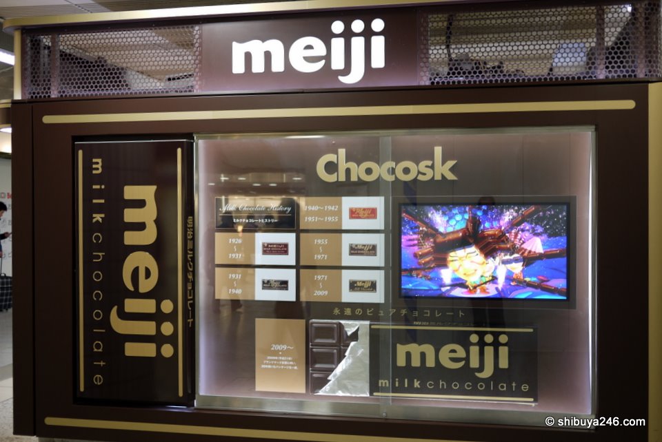meiji chocolate have wrapped an entire kiosk in their brand at Tokyo Station.